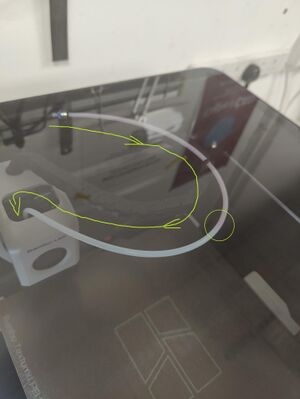 You can usually see the filament feeding through the tube