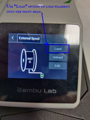 Start loading filament into the print head.