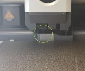Watch for the filament start to extrude from the nozzle