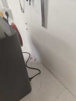 The on switch is on the back right at the bottom of the machine