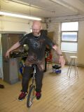 Thumbnail for File:Unicycling-in-chainmail-on-open-day-2011.jpg